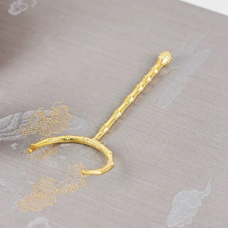 Teetassenhalter/Gabel aus goldenem Kupfer