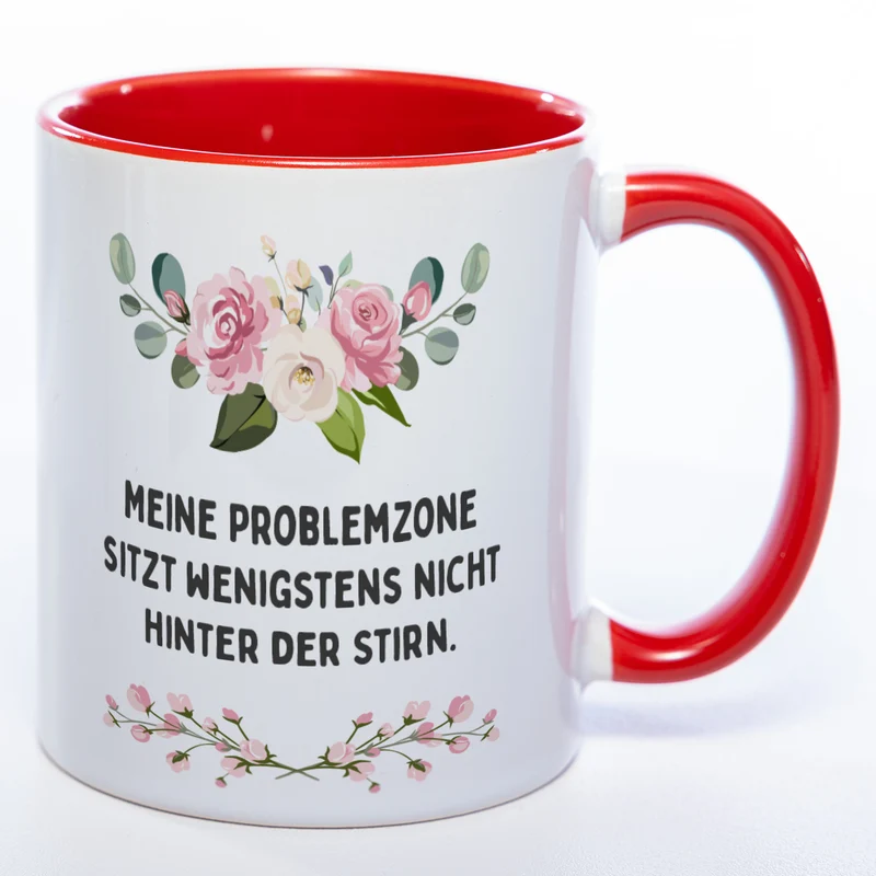 Blümchen-Tasse mit Spruch "Meine Problemzone sitzt wenigstens nicht hinter der Stirn." - Lustige Kaffeetasse spülmaschinenfest
