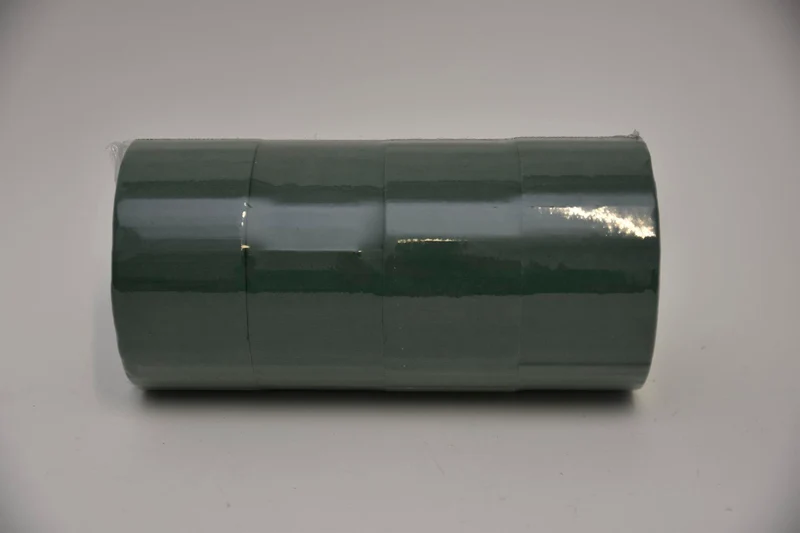 eine 4-Kuchen-Dummy-Box 14x7 cm grün.